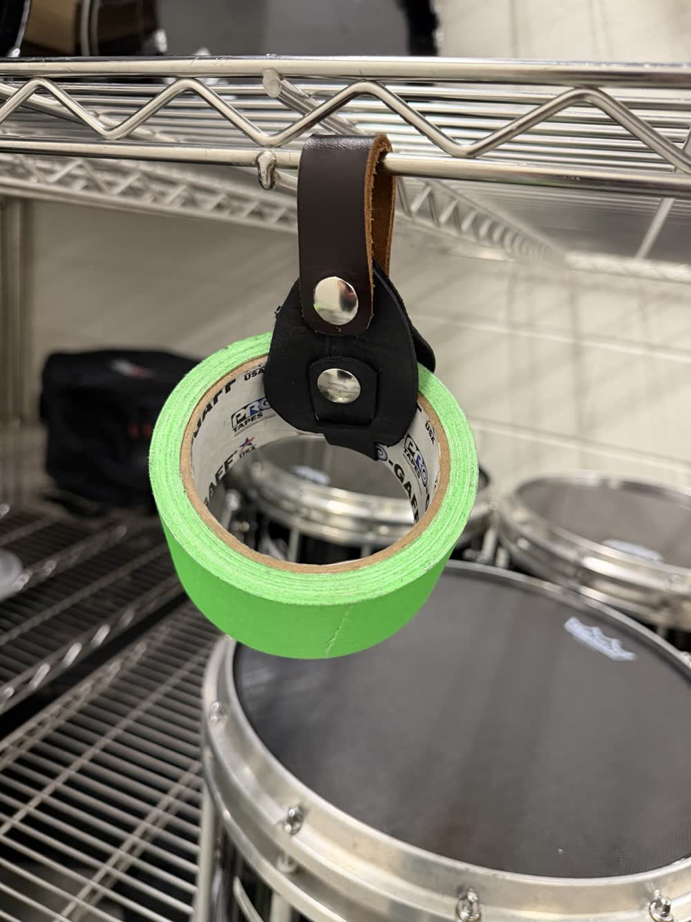 Roll of green gaffer tape held in the keeper